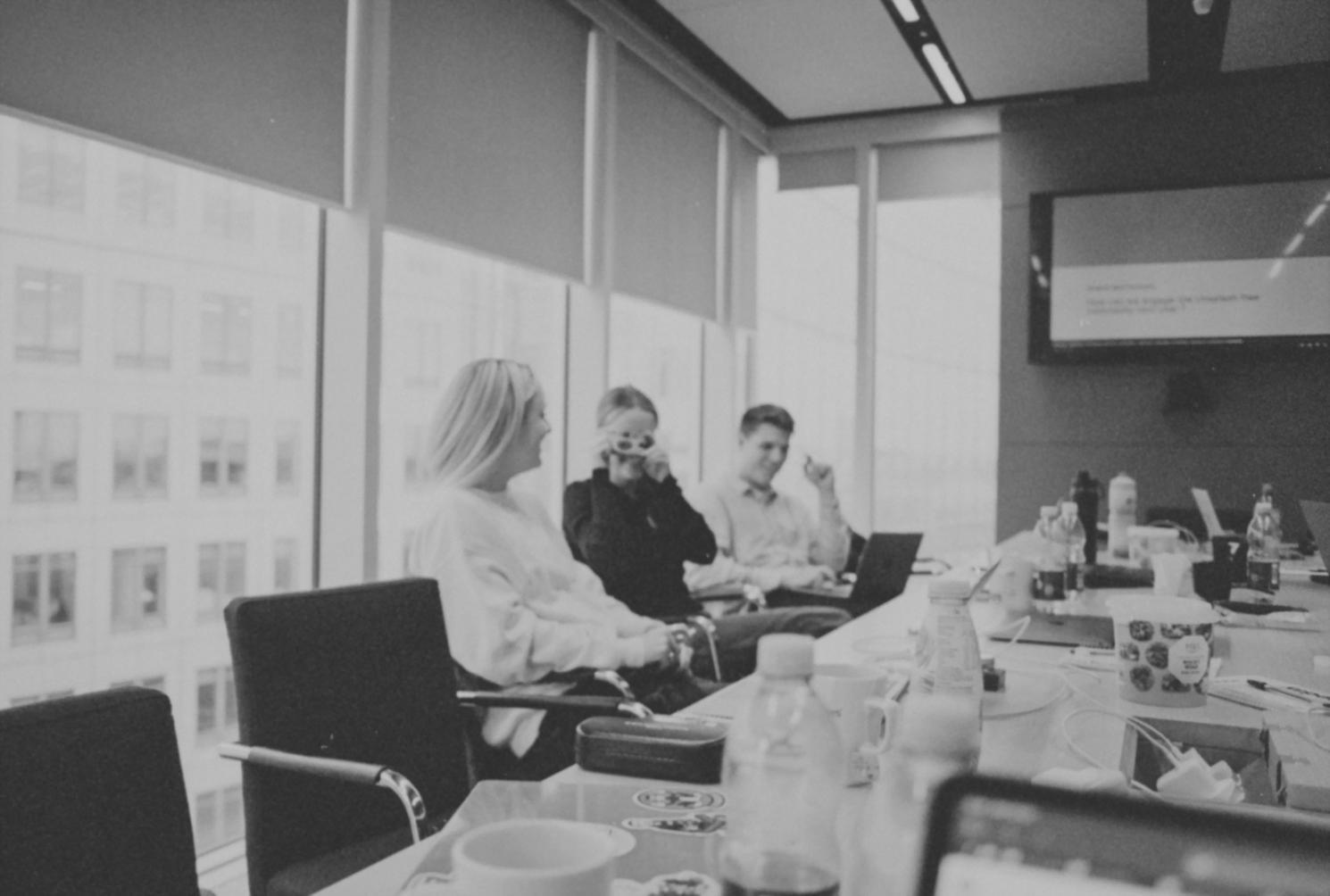 Professional conference setting with traders and developers networking and discussing automated trading strategies